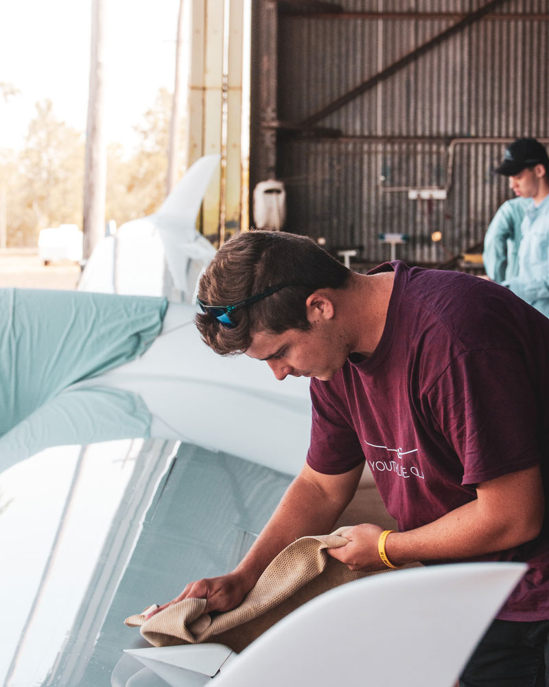 Coaching participants Aaron Hannaford and Bailey Seymour prepare the Kingaroy DG1000 for the day's flying